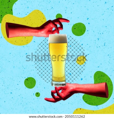 Autumn festival holidays. Creative artwork. Human hands holding chill glass of lager foamy beer isolated over blue background. Concept of festival, national traditions, drinks, Oktoberfest, ad