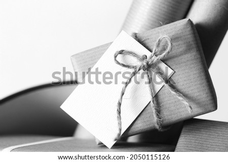 Cristmas Template Background. Wrapped Gift Decorated with Twine Bow and Greeting Card.