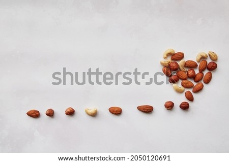 Vegan healthy snacks: almonds in shape of heart. Copy space. High quality photo