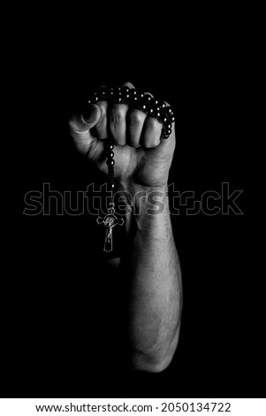 Rosary is the man's hand Royalty-Free Stock Photo #2050134722