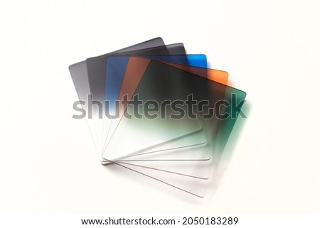 Set of graduated colored photography filters on white background