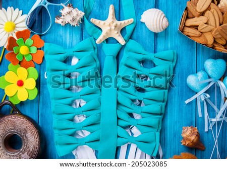 turquoise bow tie on the sea background
