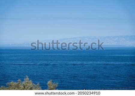 Sea view with an island in the background in a beautiful sunny weather