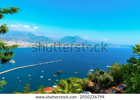 Panorama of the city of Alanya on a summer day with a view of the coast, sea and yachts