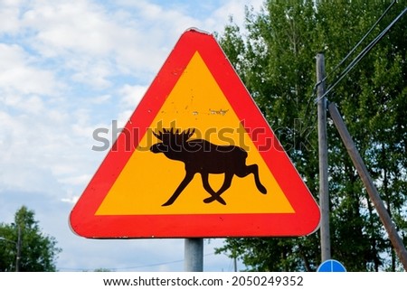 Traffic sign for game trail where wild animals (elk) cross the road