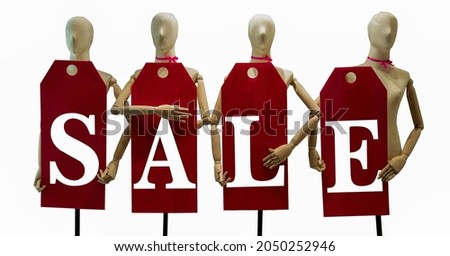 wooden figure holding a sale announcement isolated on white background Concept business, advertisement, promotion.