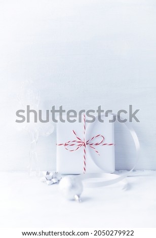 Christmas present on bright wooden background. Close up. Copy space.	