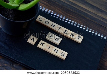 Content is a king, text words typography on wooden background, life and business motivational inspirational concept