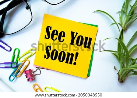 "See You Soon" on Sticky Note Royalty-Free Stock Photo #2050348550