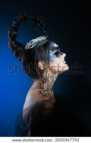 girl with creative makeup. makeup for halloween. scorpion makeup. Zodiac sign