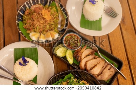 The different traditional Thai Food view from the top. Take photos to share and recommend to their customer.