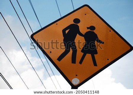 road sign about kids and adult