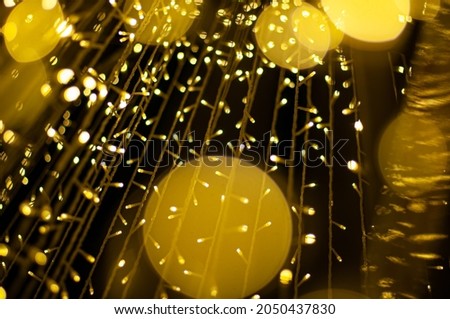 A beautiful night photo with the light from many small lanterns uniting into one kingdom to create the most beautiful circular bokeh image of the night.
