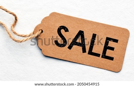 Word SALE on a tag and white background.