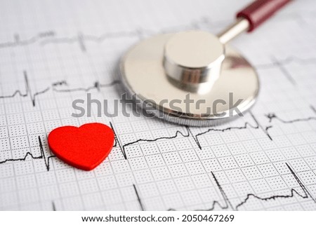 Stethoscope on electrocardiogram (ECG) with red heart, heart wave, heart attack, cardiogram report. Royalty-Free Stock Photo #2050467269