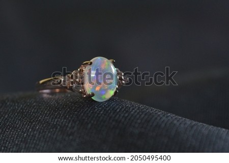 opal and white topaz ring.