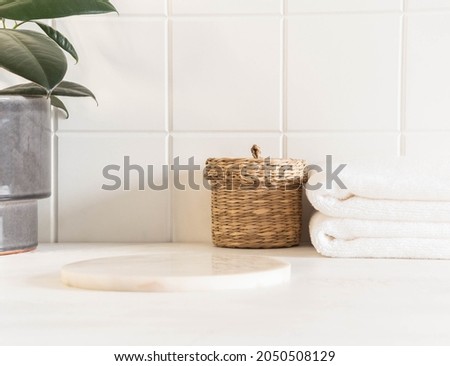 Marble white round podium for bathing products in bathroom, spa shampoo, shower gel, liquid soap. Place, background for cosmetics. Front view. Copy space Royalty-Free Stock Photo #2050508129