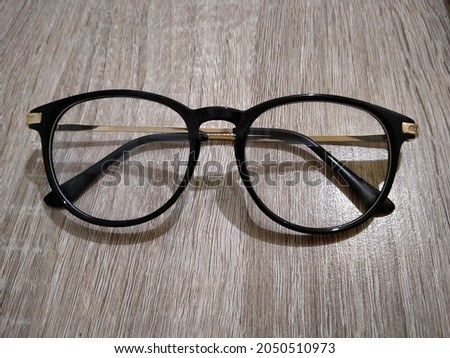 Top View of Black Glasses on a Hotel Cupboard Center Side