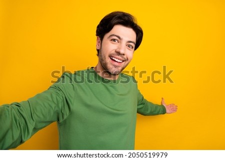 Photo of hospitable guy hand show empty space invitation wear green sweater isolated yellow color background Royalty-Free Stock Photo #2050519979