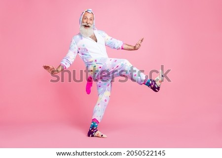 Photo of nice childish pensioner man dance posing disco wear kigurumi pajama socks isolated pink color background Royalty-Free Stock Photo #2050522145