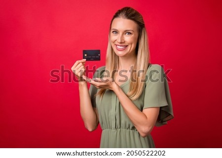 Photo of mature blond lady indicate card wear khaki dress isolated on red color background