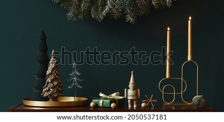 Christmas composition on brwon wooden commode with decoration, christmas tree, gifts and accessories in cozy home decor. Copy space. Template.