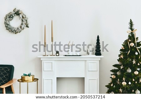 Stylish christmas living room interior with green sofa, white chimney, christmas tree and wreath, gifts and decoration. Santa claus is coming. Template.