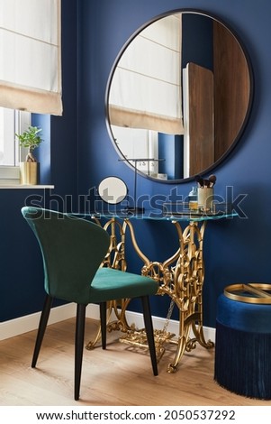 Stylish composition of woman corner in modern glamour interior design with vanity table, big rounded mirror and beautiful personsl accessories. Template. Royalty-Free Stock Photo #2050537292