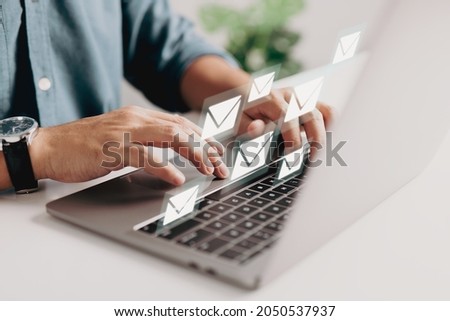The concept of email marketing is when a corporation sends out many e-mails or digital newsletters to its customers. Royalty-Free Stock Photo #2050537937