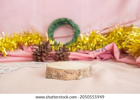 Christmas and New Year's Minimalist Concept. The composition displays the product. displaying products on wood with christmas and new year decorations
