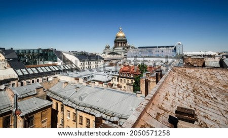 view from the rooftops to St. Isaac's Cathedral. European city roofs. view of the city from the roof. saint petersburg roofs. tourist trend. visiting card of the city.
