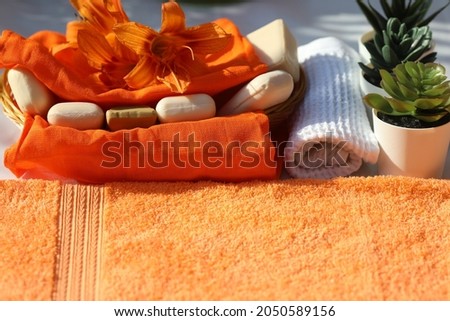 Healthy spa bath products, soap, towels, spa flowers on white background, self care and relaxing, flatlay, top view 
