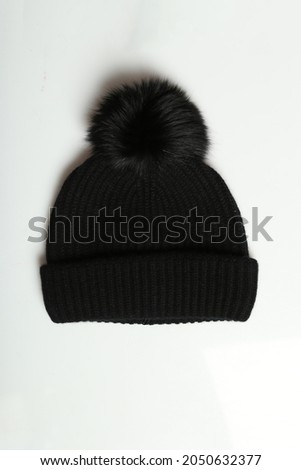Winter woolen hat on a white background