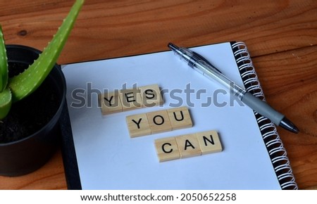 Yes you can, text words typography on papper background, life and business motivational inspirational concept
