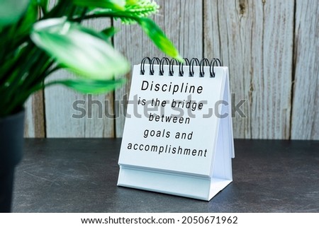 Motivational and inspirational quote with phrase on white stand paper