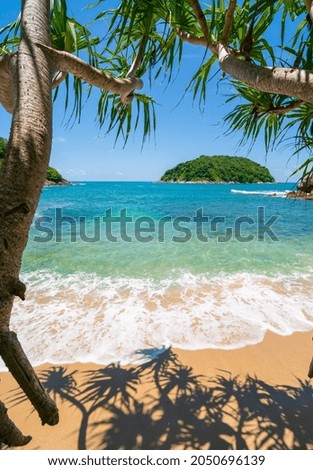 Tropical beach sea and island in sunny day