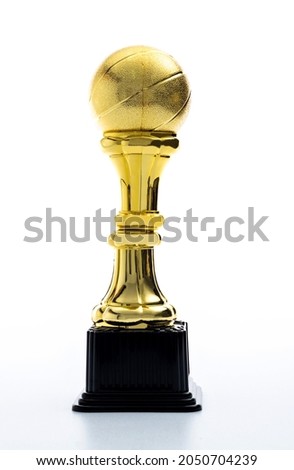 Golden basketball trophy on white background.