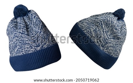two knitted dark  blue white hat isolated on white background.hat with pompon .