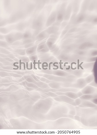 The​ abstract​ of​ surface blue water​ reflected​ with​ sunlight for​ background. The​ pattern​ of surface​ blue​ water in the​ deep sea for​ blue​ background. Water​ splashed​ for​ background.