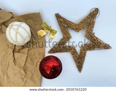 Cup with Santa picture, christmas decorations, golden star and white background with place for text. Ideas for new year celebrating.
