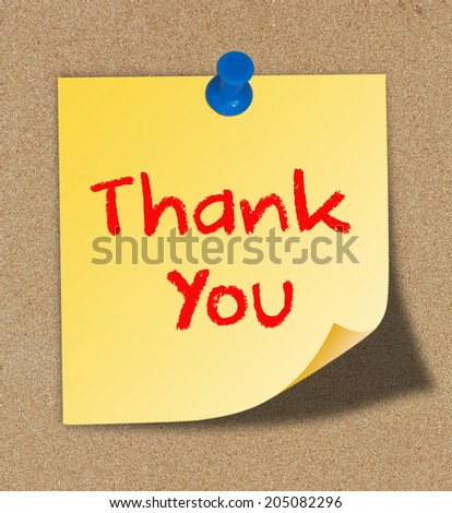 Thank you on yellow note pinned on cork board background.