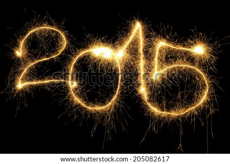 New Year 2015 formed from sparking digits over black background Royalty-Free Stock Photo #205082617