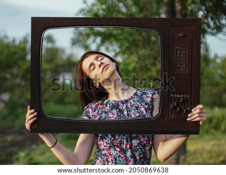 Portrait of young woman inside old retro television frame with closed eyes, technology and publicity mental problems Royalty-Free Stock Photo #2050869638