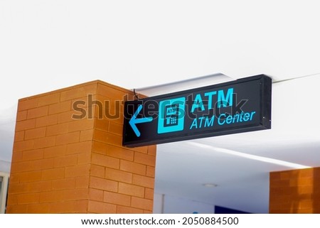 picture of blue and black ATM Center sign