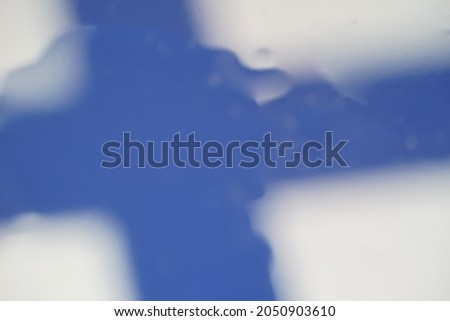 Finland or Finnish flag, Blur in water drop for abstract design background