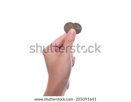 Woman hand show thai coin isolated on a white background