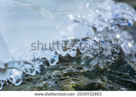 spring ice on a mountain river, selective focus