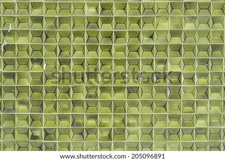 Bright green tiles in front of building constuccion