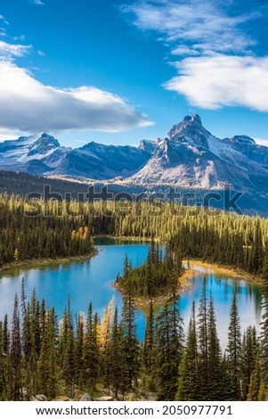 Scenic View of Glacier Lake with Canadian Rocky Mountains in Background. Sunny Fall Day. Located in Lake O'Hara, Yoho National Park, British Columbia, Canada. Royalty-Free Stock Photo #2050977791