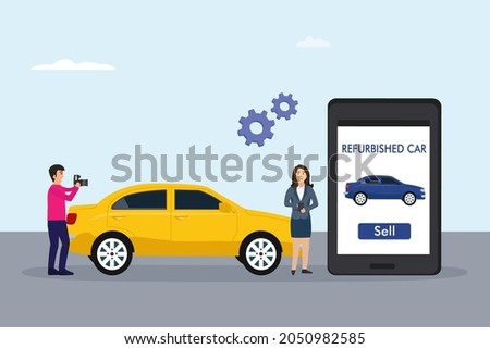 Car owner selling online a refurbished car on mobile phone application while taking photo and video on the car side